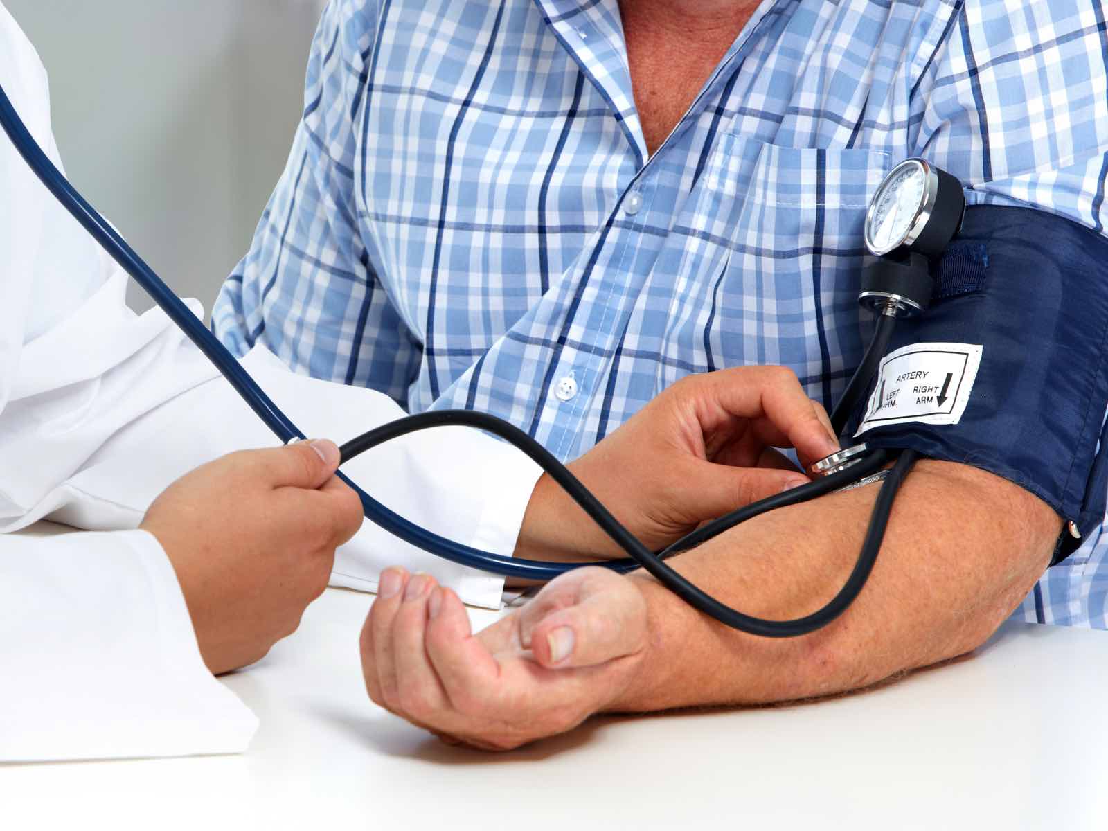 Doctor consulting patient at Clinic Plus Urgent Care